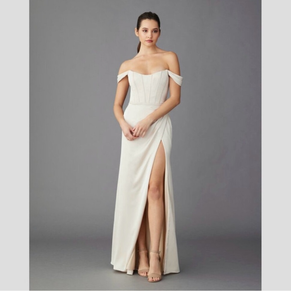 Lazaro Dani cream maxi gown with off the shoulder neckline and high slit